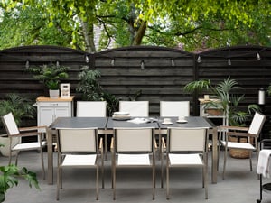 Table de jardin acier inox plateau granit triple noir flambé 220 cm avec 8 chaises en textile blanc GROSSETO